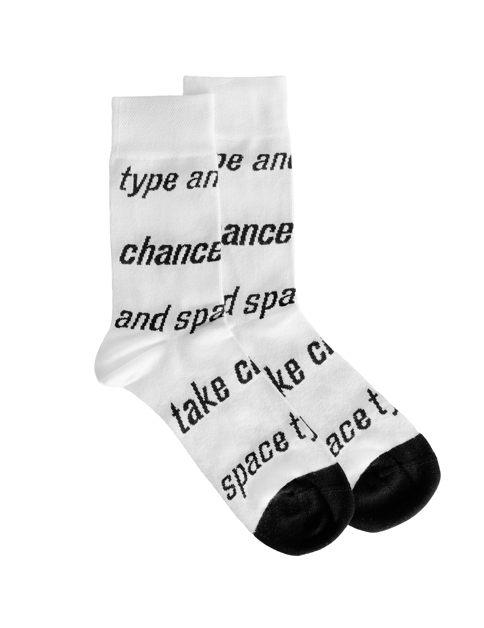 White socks with black typography in the shape of stripes that say ‘take chances’ and ‘type and space’. 